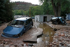 Colorado flooding destroys cars as road closings stop auto repair work